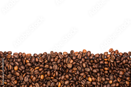 Frame made of grains of black coffee on a white background