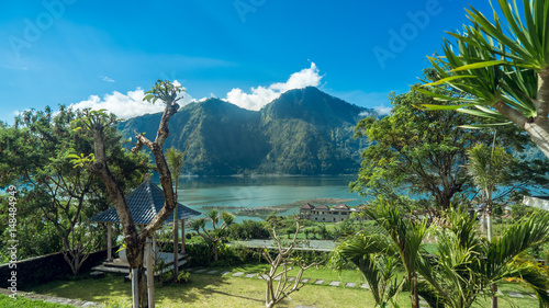 Volcanic lake in front of magnicent volcano in a tropical island photo