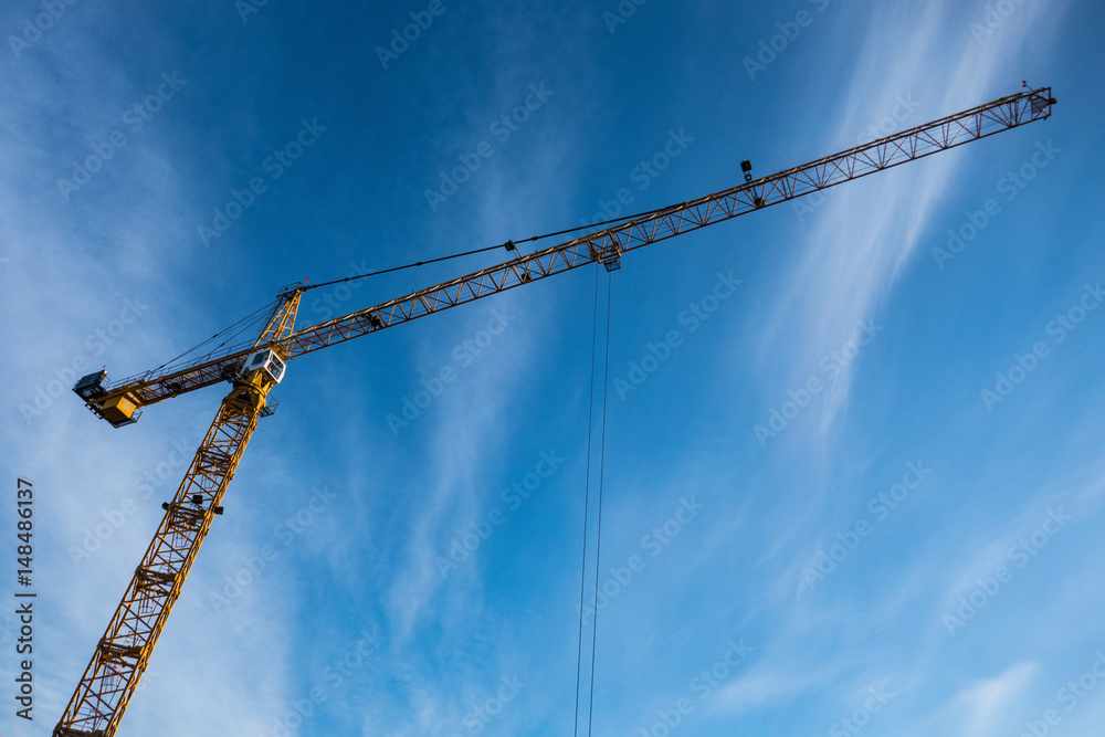 Construction crane against blue sky Construction crane against blue sky