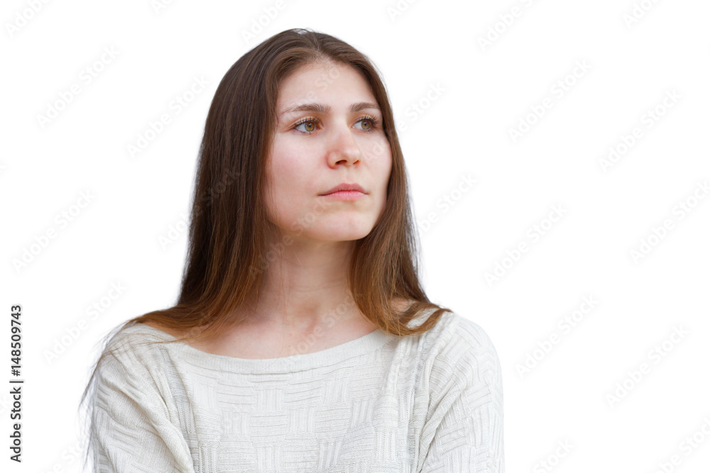 Portrait of a young brunette woman in a light sweater with a melancholy and thoughtful expression looking away isolated on white background. Demonstration of various emotions. Portrait of a young brunette woman in a light sweater with a melancholy and thoughtful expression looking away isolated on white background. Demonstration of various emotions.
