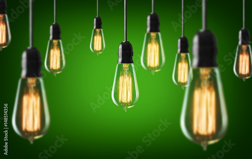Vintage light bulbs on green background