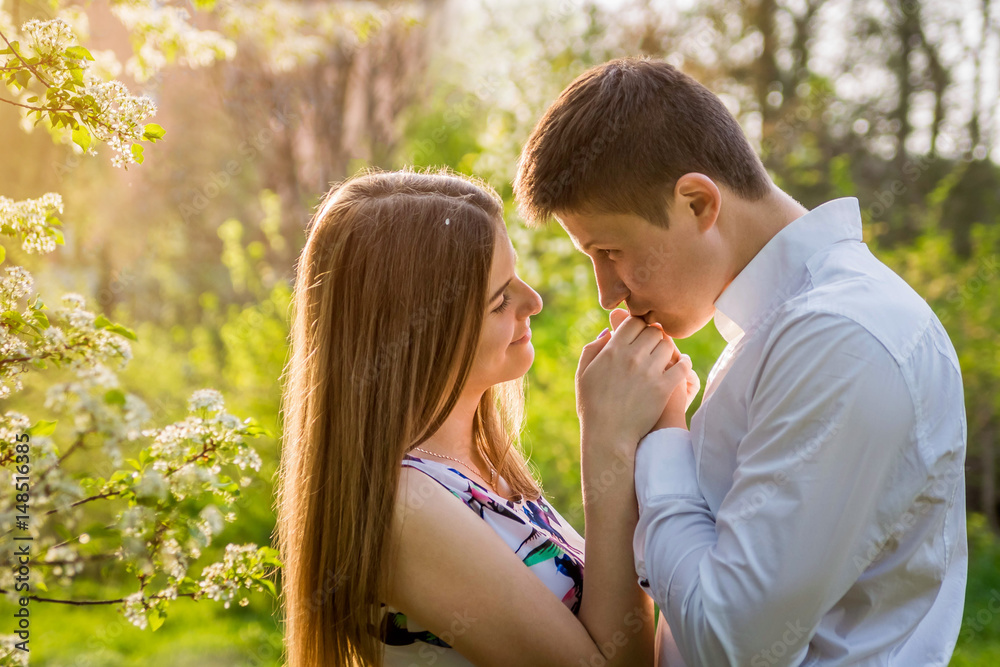 Portrait of young love couple in the garden Portrait of young love couple in the garden