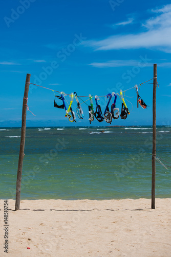 Snorkelling masks hanging on the beach in Sri Lanka