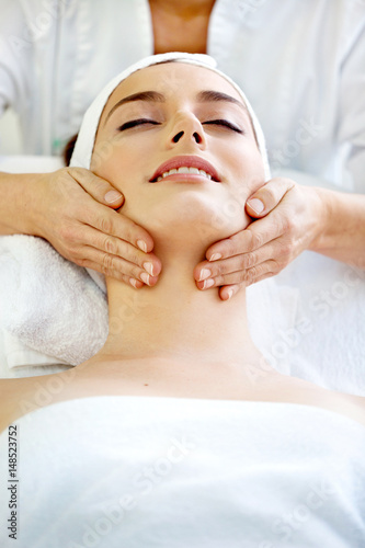 Spa salon: Beautiful Young Woman having Neck Massage.