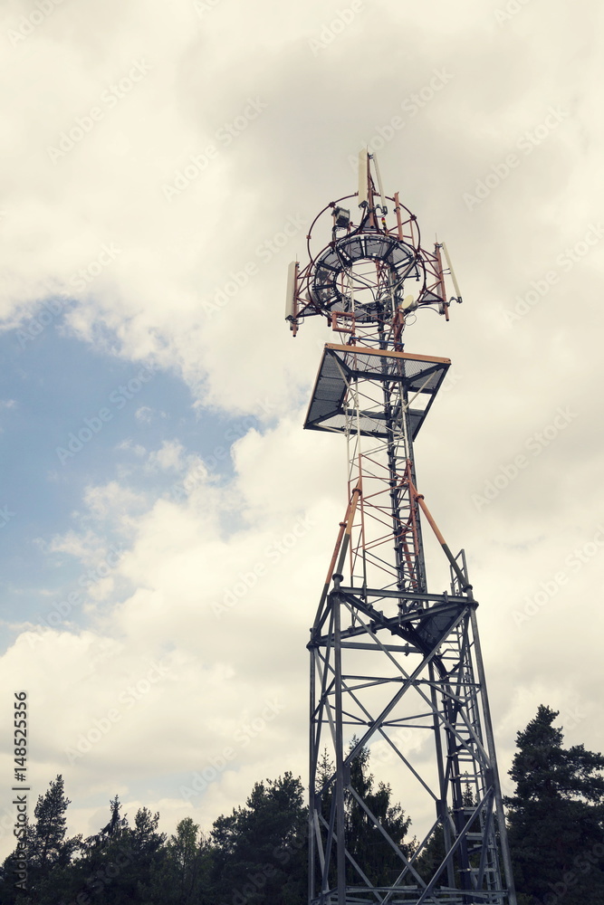 Transmitters and aerials on telecommunication tower during sunset Transmitters and aerials on telecommunication tower during sunset