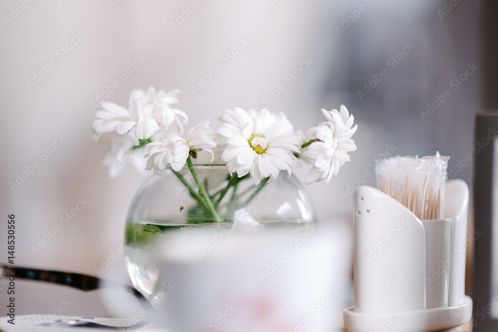 Vase with flowers in a cafe