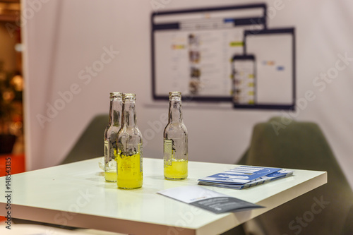 View of three small glass bottles with a little drink