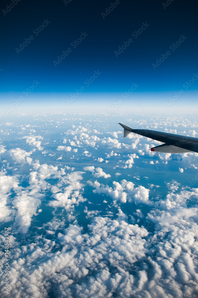 blue sky and clouds. View from the airplane window