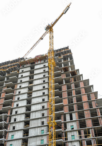 Building of large modern apartment scraper on the construction site