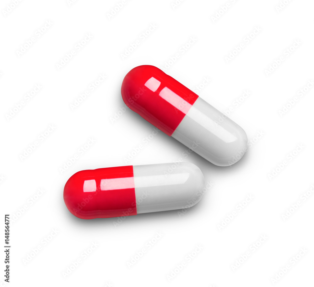 close-up of two medical capsules isolated on white background