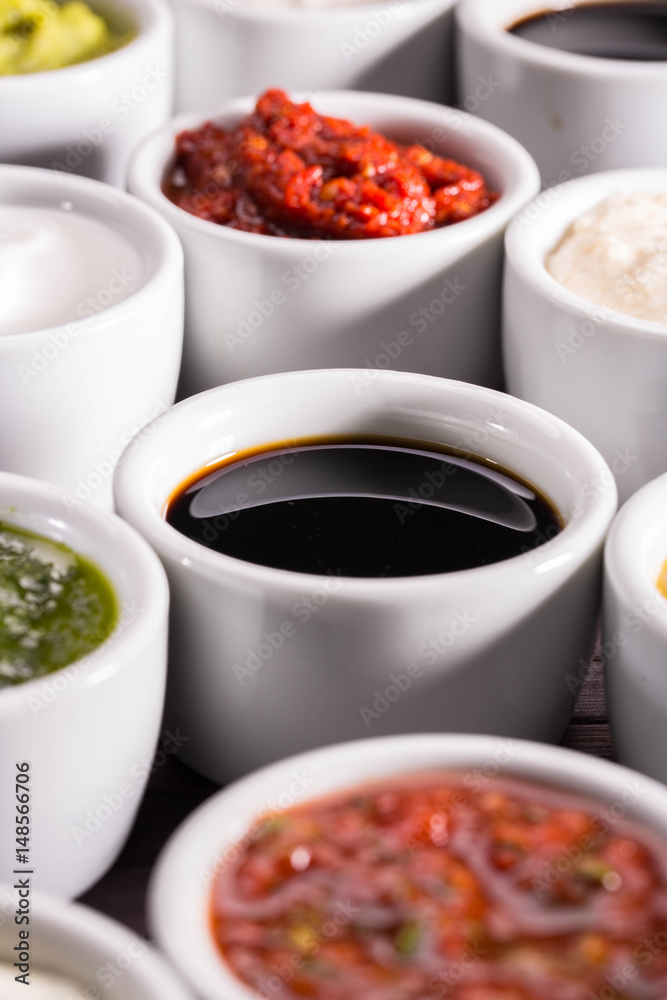 Pomegranate sauce with ketchup and ajika, a tomato, garlic, paprika and spices Pomegranate sauce with ketchup and ajika, a tomato, garlic, paprika and spices