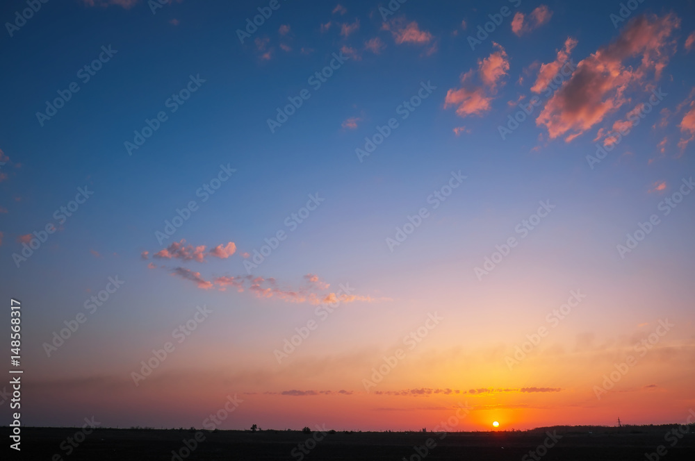 Fototapeta premium Fiery orange sunset sky. Beautiful colorful background.