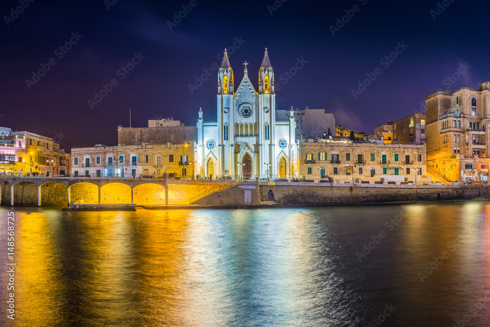 Balluta bay, Malta - The famous Church of Our Lady of Mount Carmel at Balluta bay by night