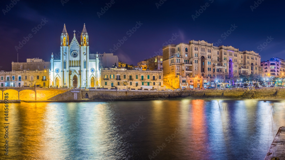 Balluta bay, Malta - The famous Church of Our Lady of Mount Carmel at Balluta bay by night