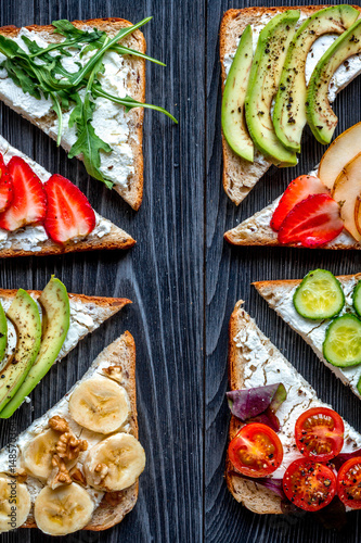 fitness breskfast with homemade sandwiches dark table background top view photo