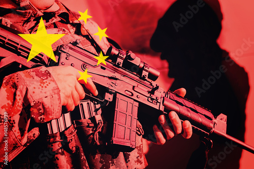 Photography Soldier with machine gun with national flag of China