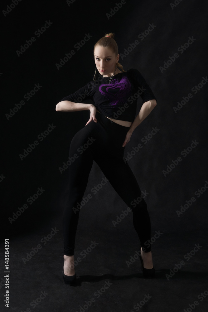Vogue dancer posing on dark background