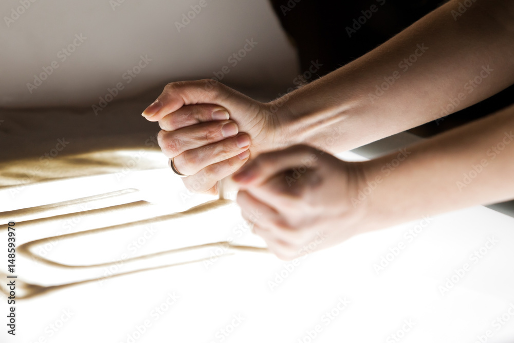 Sand animation. Girl's hands drawing sand closeup Sand animation. Girl's hands drawing sand closeup