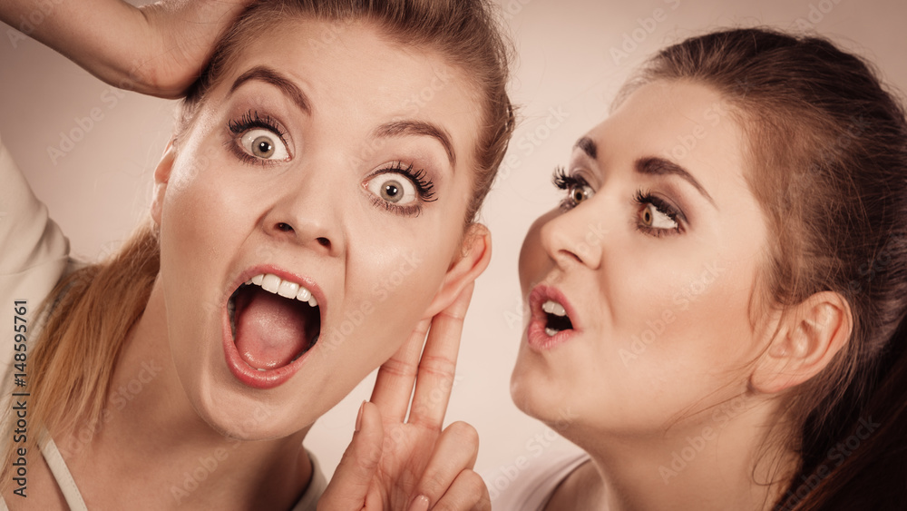 Two women telling gossip Two women telling gossip