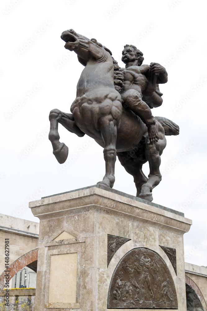 Bronze sculpture of a man riding a horse in downtown Skopje, Macedonia