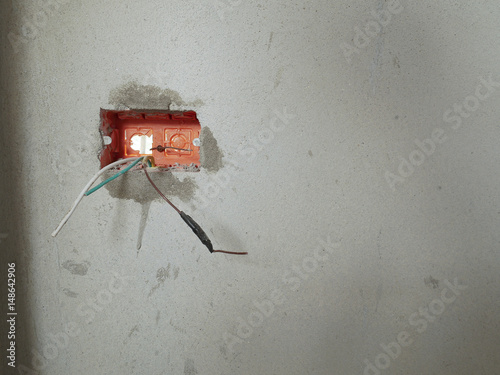 Orange Socket box nstallation on the wall photo