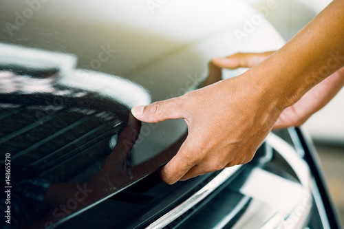 Cropped image of automobile mechanic repairing car in store, day time © PPstock