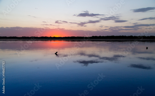 sunset on the lake as a backdrop © schankz