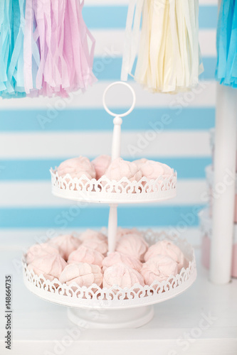 Candy bar. Decor for baby's or child's Birthday party. Three round pink boxes. Pink, blue and white colors