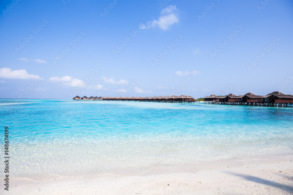 Tropical Over Water Bungalows with White Sand Beach
