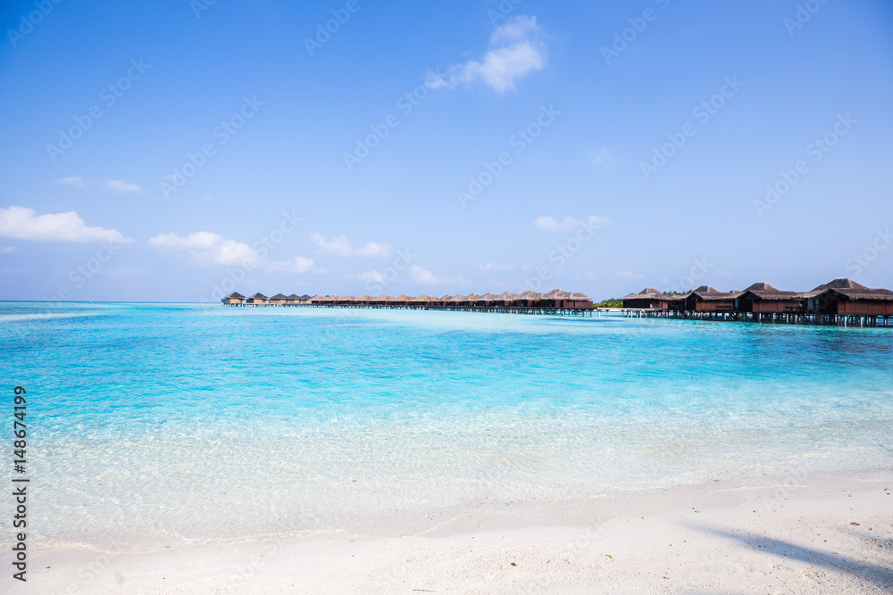 Tropical Over Water Bungalows with White Sand Beach Tropical Over Water Bungalows with White Sand Beach