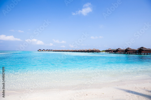 Tropical Over Water Bungalows with White Sand Beach