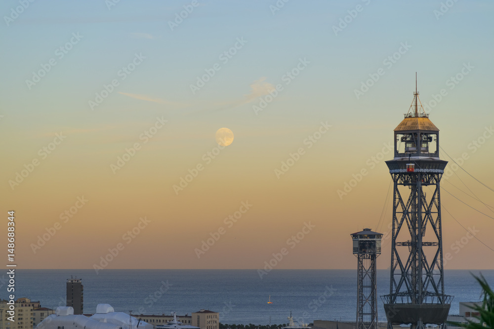 Barcelona lighthouse next to the moon Barcelona lighthouse next to the moon