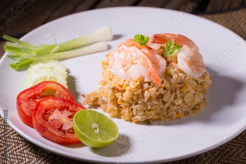 Thai fried rice with prawns in a white plate.