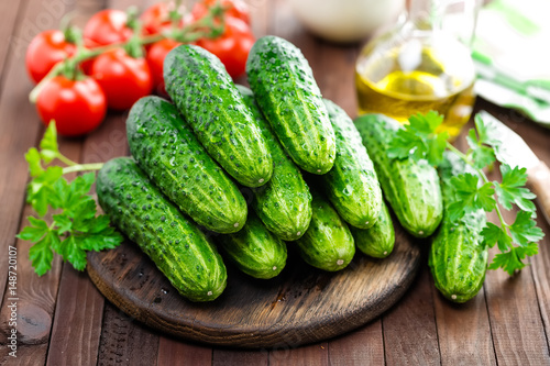 Fresh cucumbers on wooden table
