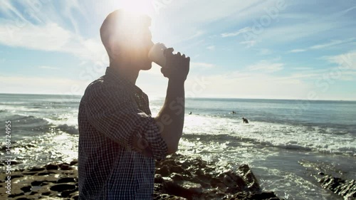 True coffee lover on a beach