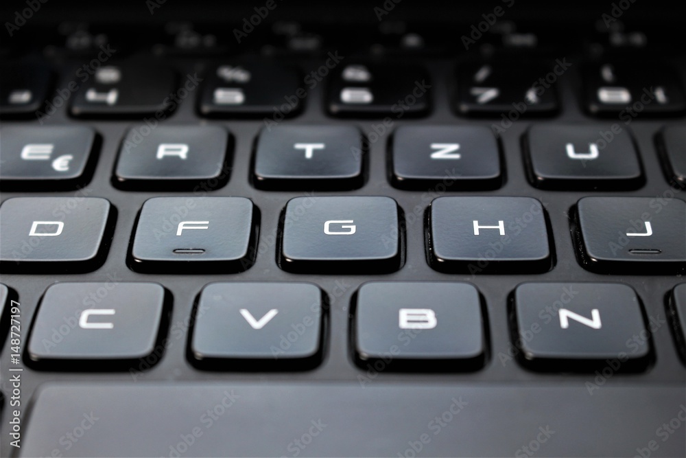 An image of a keyboard with finger