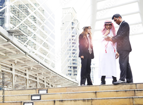 Businessman team and arab man looking tablet for new project while working at constructions site.