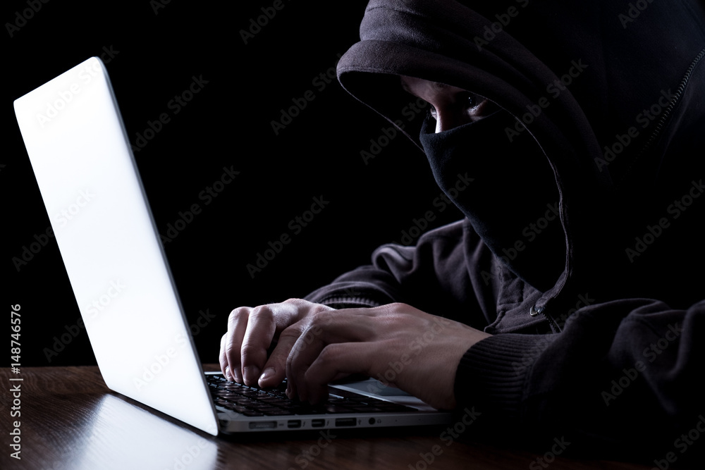 Anonymous hacker in the dark Anonymous hacker in the dark