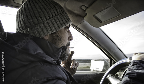 Man smoking driving © celiafoto