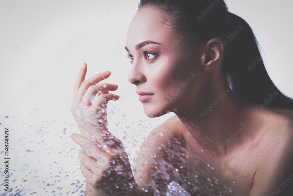 Young beautyful woman under shower in bathroom Young beautyful woman under shower in bathroom