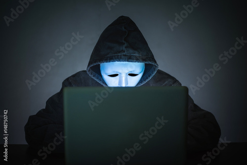 Hacker wear an anonymous mask.