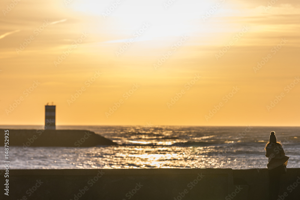 Vila Nova de Gaia small lighthouse seen from Porto river bank, Portugal