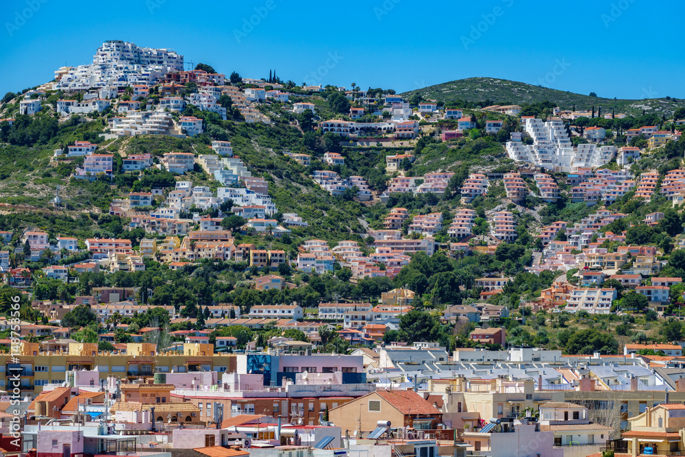 Crowded hill with modern flats in the coast