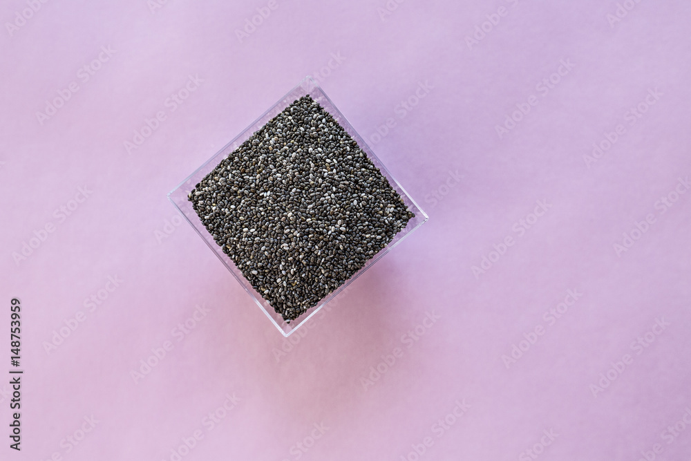 Organic Dry Black and White Chia Seeds against a background Organic Dry Black and White Chia Seeds against a background