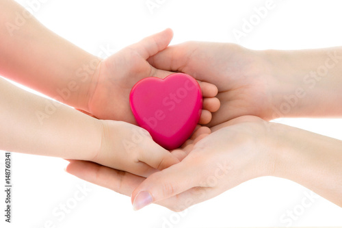 Mother s and daughter s hands keep heart