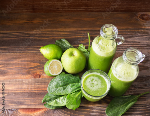 Fresh juice, smoothies, green Apple, lime and spinach in glass small bottles
