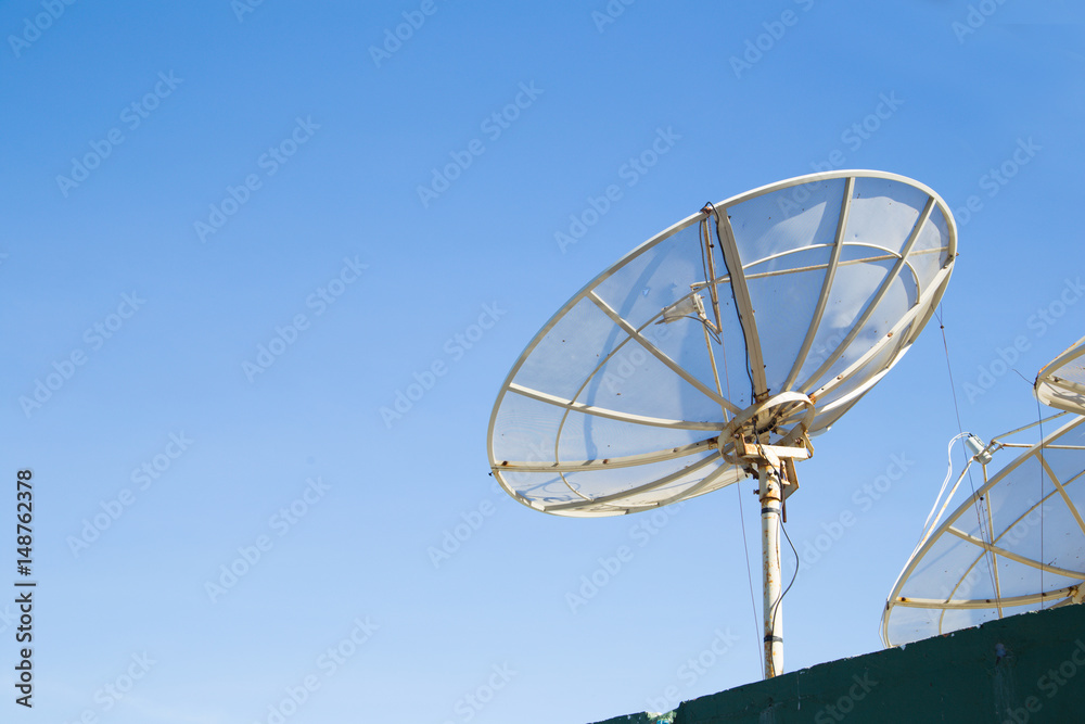 satellite dish antennas under sky