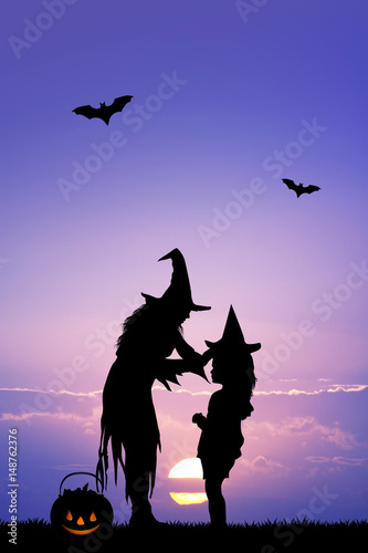 mother and little girl with witch costume
