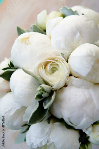 Wedding bouquet of white peonies and ranunculuses.Wedding floristry © gal2007
