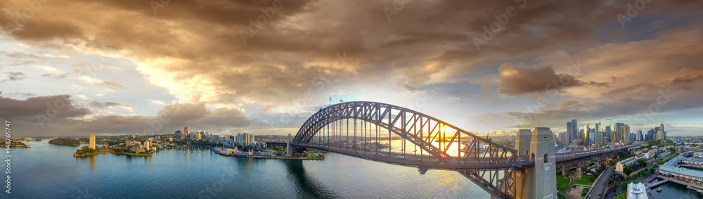 Sydney Harbour Bridge at sunset, panoramic view from the sky Sydney Harbour Bridge at sunset, panoramic view from the sky